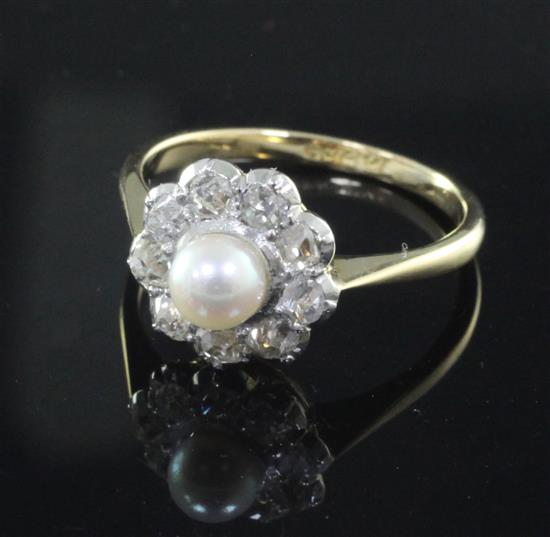 A mid 20th century 18ct gold and platinum, cultured pearl and diamond cluster ring, size N.